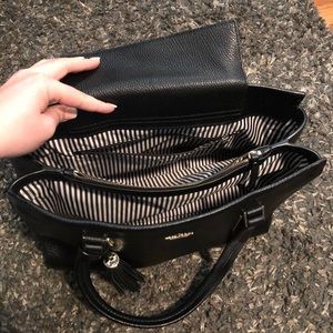 Black Kate Spade purse with striped interior